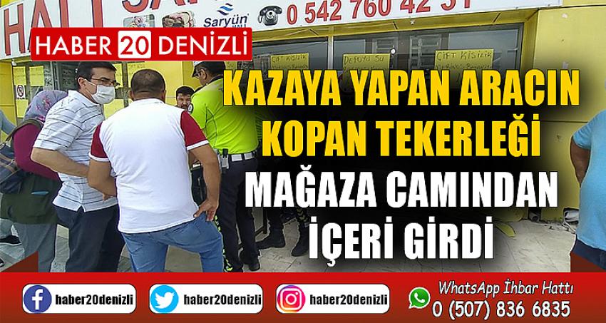 Kazaya yapan aracın kopan tekerliği mağaza camından içeri girdi