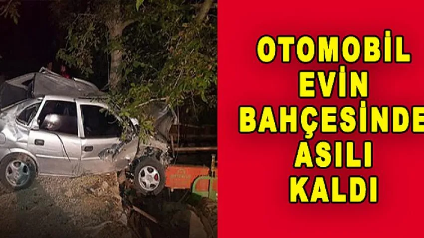 Otomobil Evin Bahçesinde Asılı Kaldı