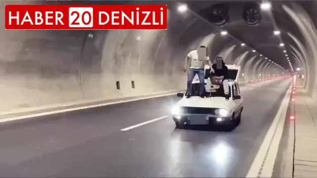 Seyir halindeki aracın üzerine çıkıp alkollü içecekle ellerini yıkadılar