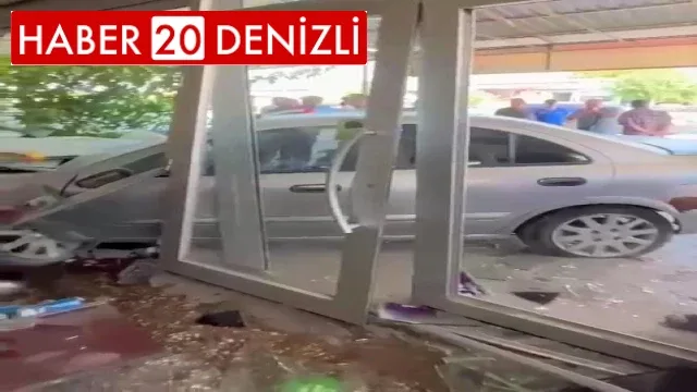 Virajı alamayan otomobil tamirhaneye daldı