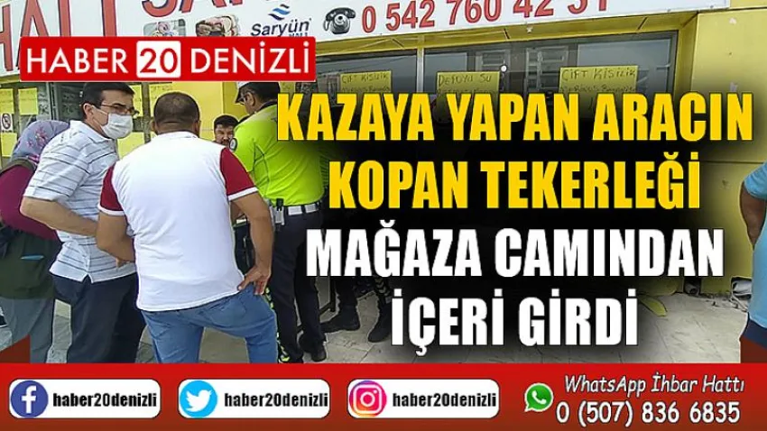 Kazaya yapan aracın kopan tekerliği mağaza camından içeri girdi