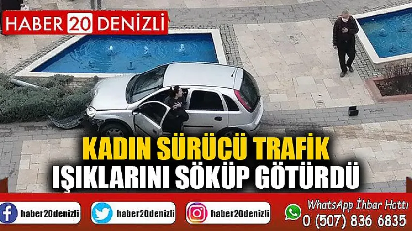 Kadın sürücü trafik ışıklarını söküp götürdü